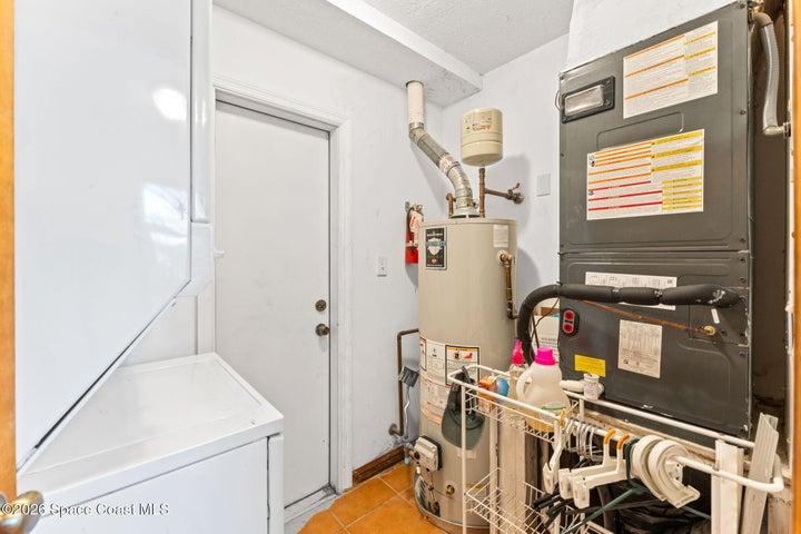 ADU laundry area, exterior door exit to side yard