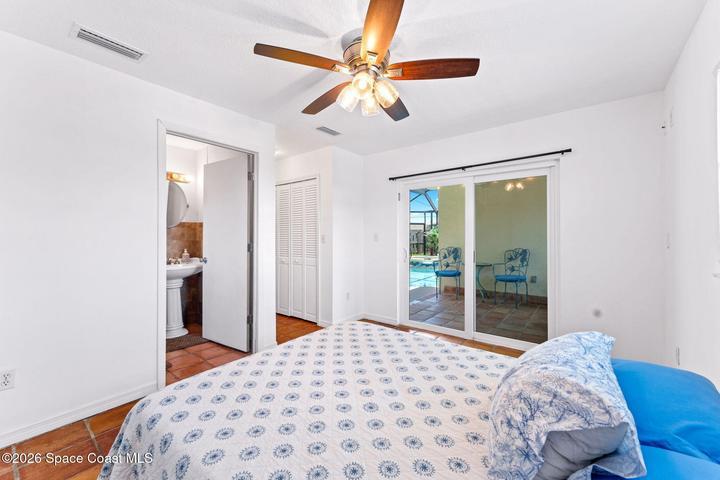 ADU second bedroom, with en suite, slider to pool area, also exterior door