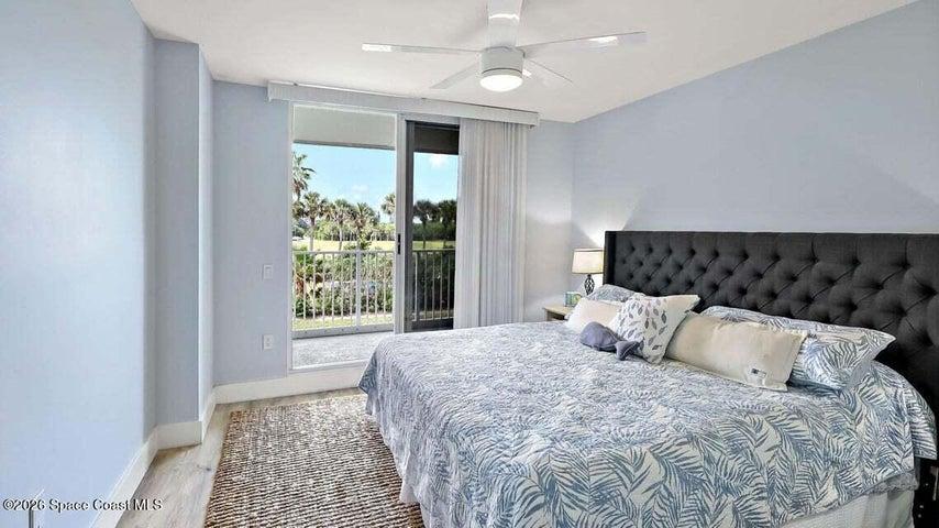 This secondary bedroom is currently being utilized as the primary bedroom, while the designated primary bedroom is being used as a home office.