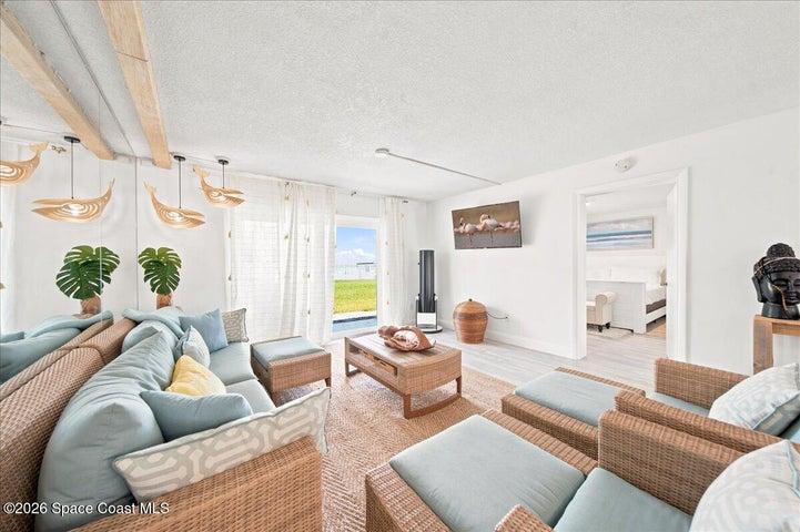 Spacious living area with coastal inspired finishes