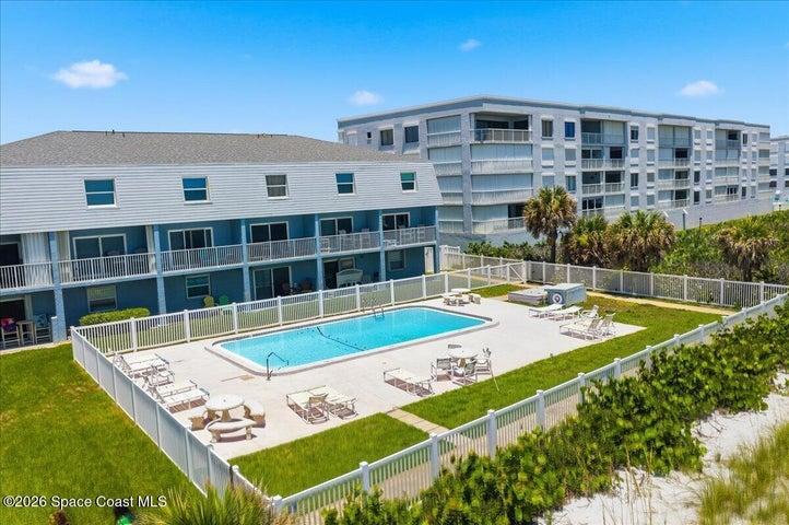 Relax and unwind at the community's private pool, offering the perfect place to soak up the Florida sunshine just steps from the beach.