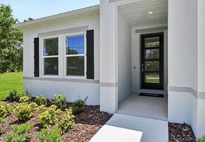 Covered front entry & stunning upgraded glass door!