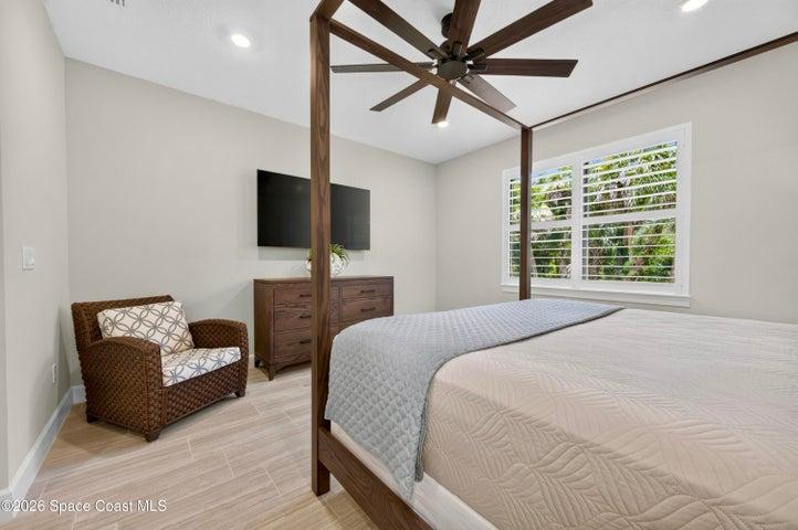 BEDROOM SUITE:  Plantation Shutters over large window with views out to preserve. Hunter statement ceiling fan with remotes, LED Lighting, Porcelain tile floor, TWO WALK-IN CLOSETS!