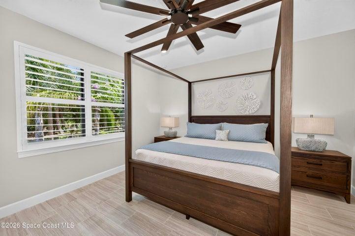 BEDROOM SUITE:  Plantation Shutters over large window with views out to preserve. Hunter statement ceiling fan with remotes, LED Lighting, Porcelain tile floor, TWO WALK-IN CLOSETS!