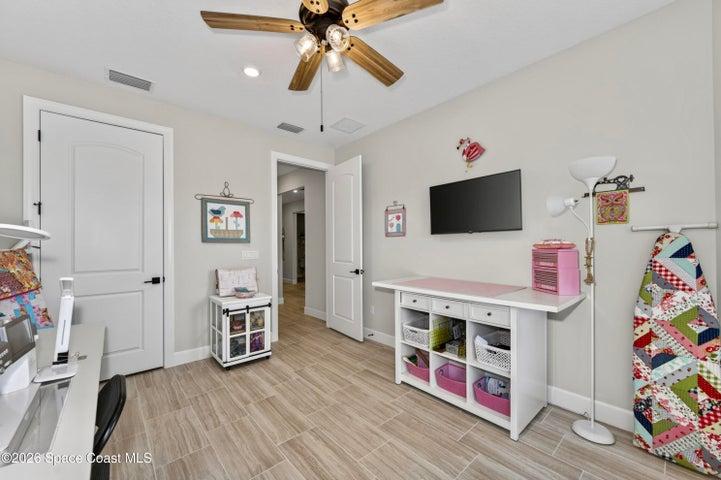 BEDROOM 2 - Opted to upgrade from a Den to a guest bedroom featuring: Bay window expanding living space square footage, In-wall TV mount reinforcement with elevated electrical outlet, closet, Private hallway separating guest bedrooms.