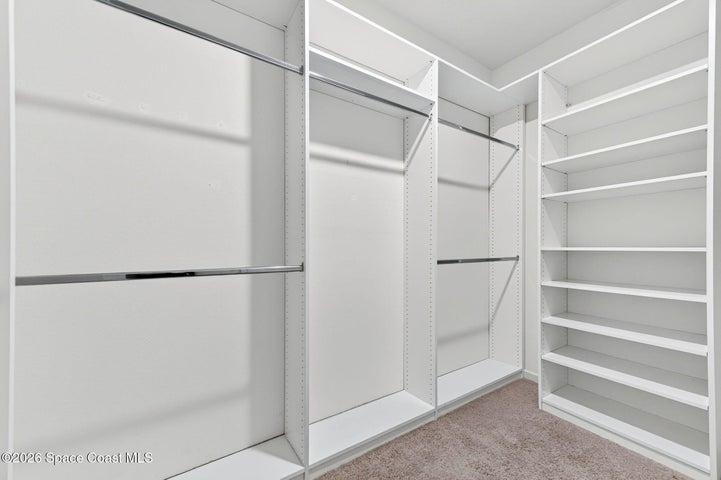 Spacious custom walk-in California closet with abundant storage