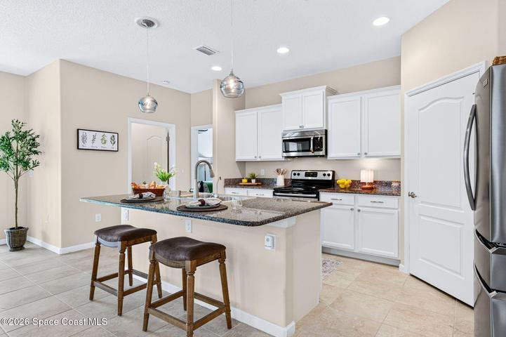 Generous center island with breakfast bar seating. Sink has reverse osmosis!