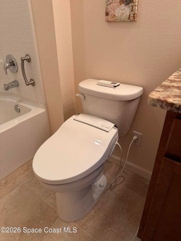 Guest bath features a premium bidet with a remote!
