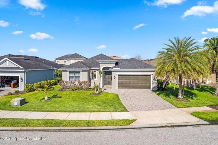 Spacious driveway leading to a well-maintained garage and entryway