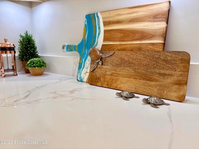 BUTLERS PANTRY and Appliance Center.  A functional and aesthetic fluid extenstion of the kitchen: Quartz countertop, Ideal prep-station and/or coffee bar, Motion-sensor lighting, Custom cabinetry with pot drawers, soft close, two Lazy Susans, 42" Upper cabs++.