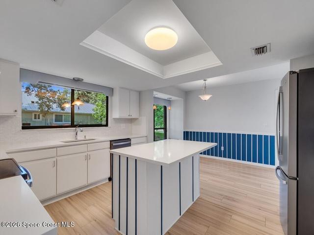 ISLAND IN KITCHEN AND VIEW TO NOOK