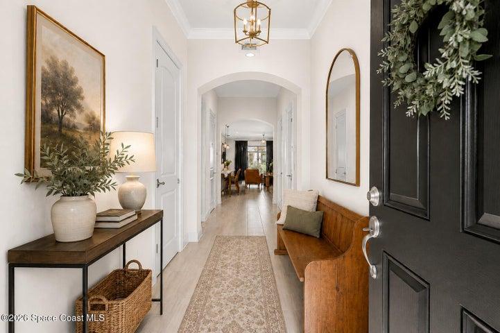Elegant foyer with soaring ceilings and a welcoming first impression