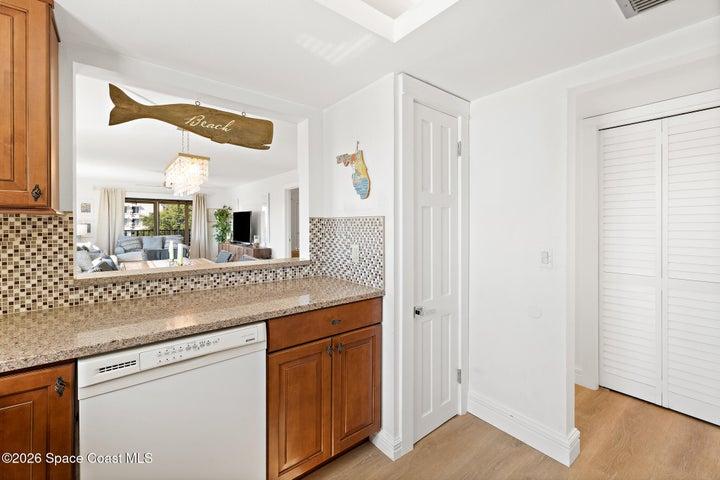 Kitchen pass-through with dishwasher and pantry closet, Cocoa Beach condo