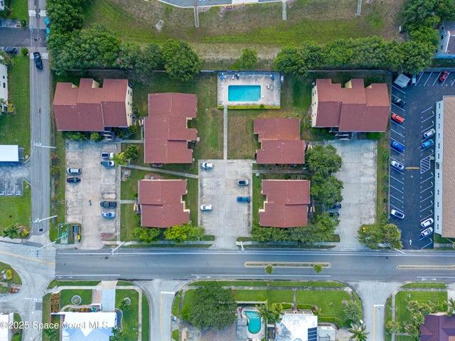 Aerial of condo complex and pool
