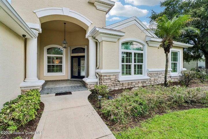 Double door entry features leaded glass.