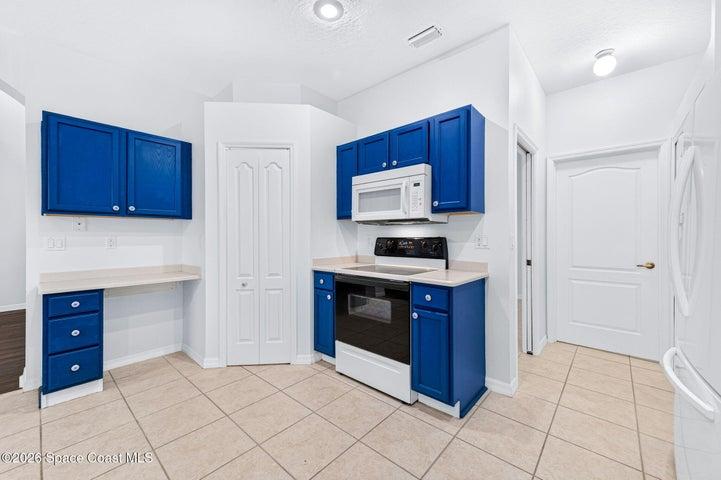 Kitchen View with Walk-In Pantry Looking Towards Laundry Room
