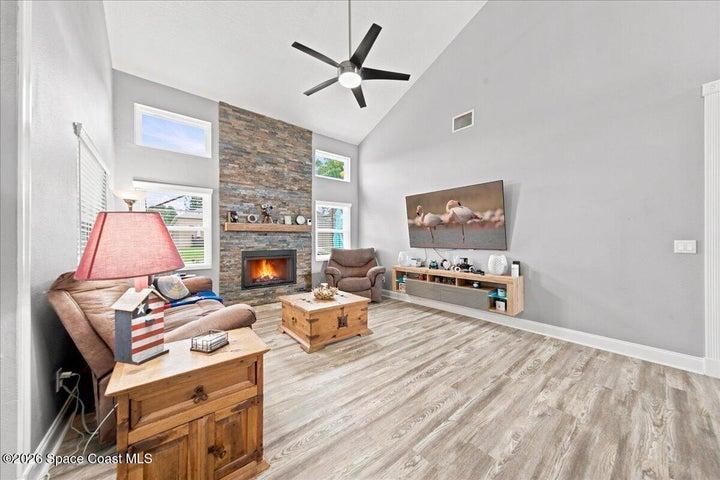 Family room + Floor-to-ceiling Stone Fireplace