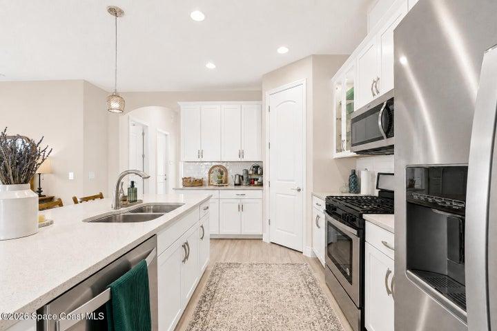 Well-appointed kitchen with ample cabinetry and counter space