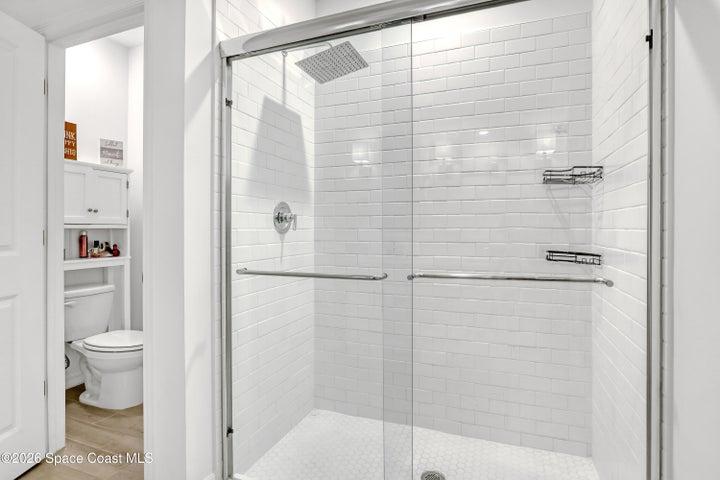 Owner's suite bathroom with separate toilet area