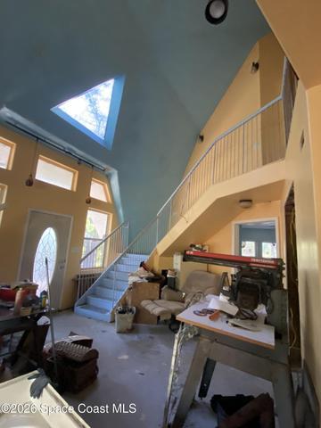 Entry to living room & upstairs. Unfinished project.