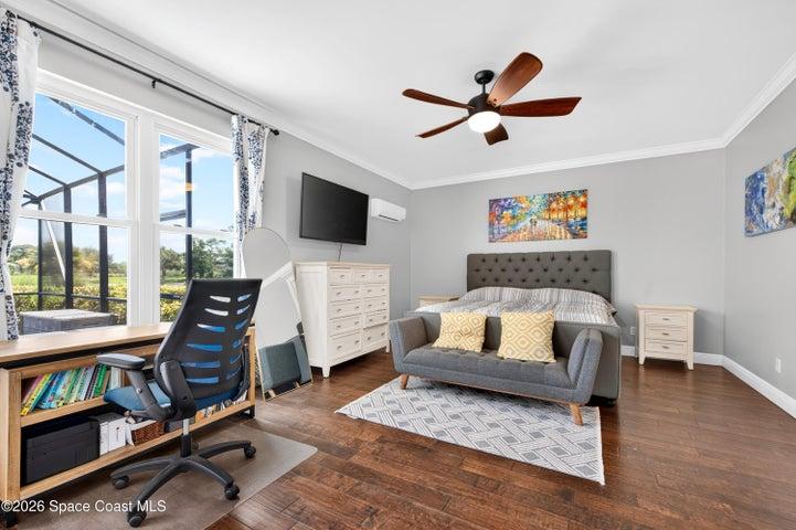 Primary Bedroom 1st floor with view of pool, golf course and lake