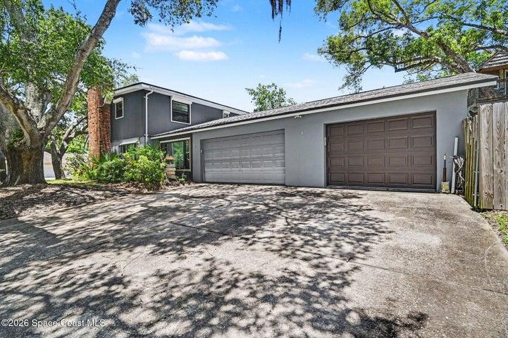 Single door Garage opens on both ends, street and backyard.