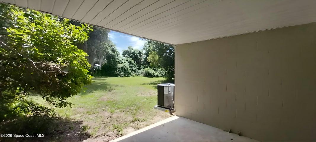 Back yard view from car port area