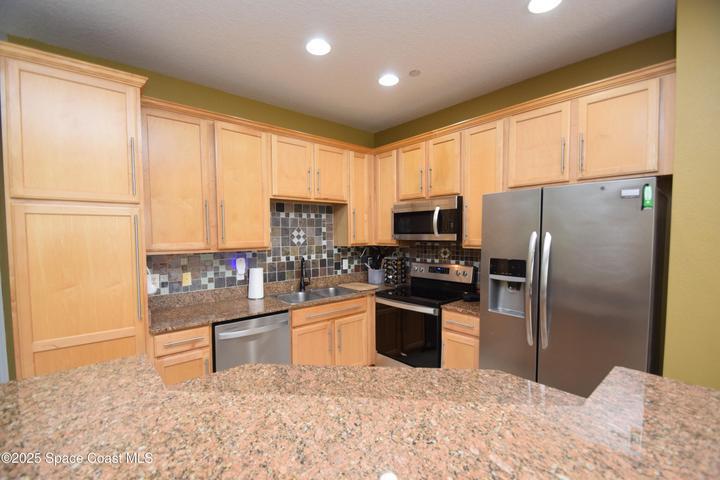Wood cabinets with stainless appliances