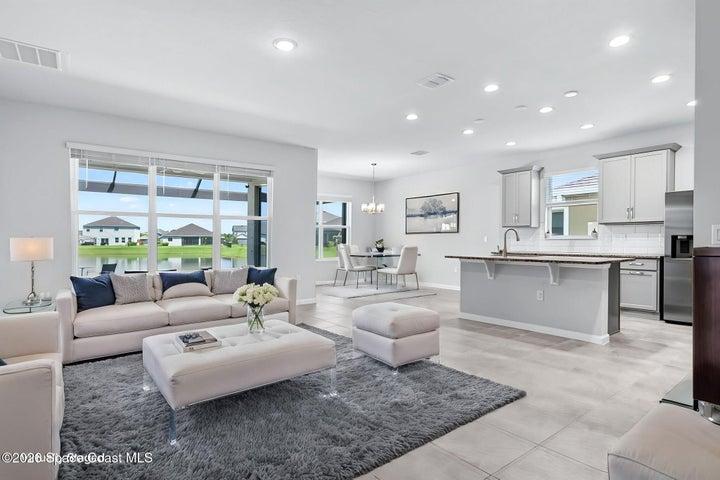 Virtually staged open plan main living, kitchen, dining areas