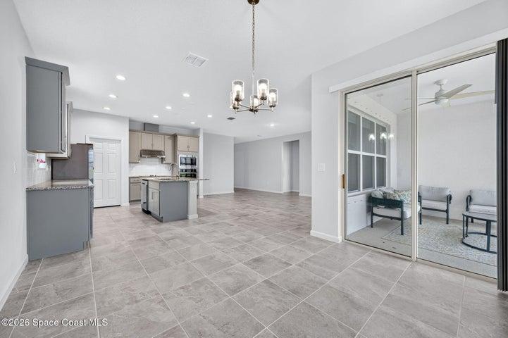 View of open plan living area from dining area