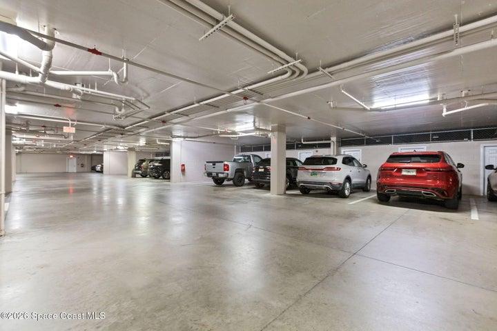 Private enclosed parking garage on ground level