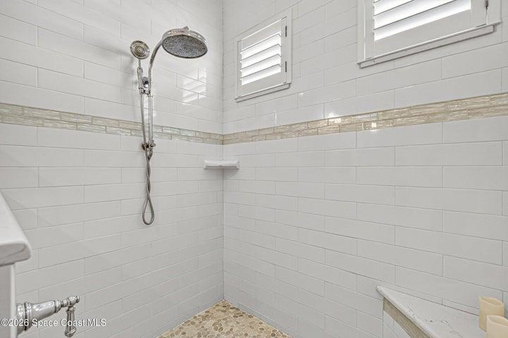 Walk in Shower with Beautiful Tile Accent, Bench, Rainhead and Diverter