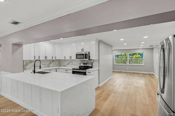 view into kitchen and dining from living room