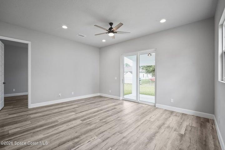 Family room with impact sliders to back yard