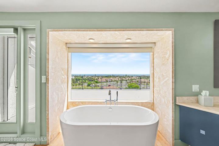 primary bath by deck ocean view