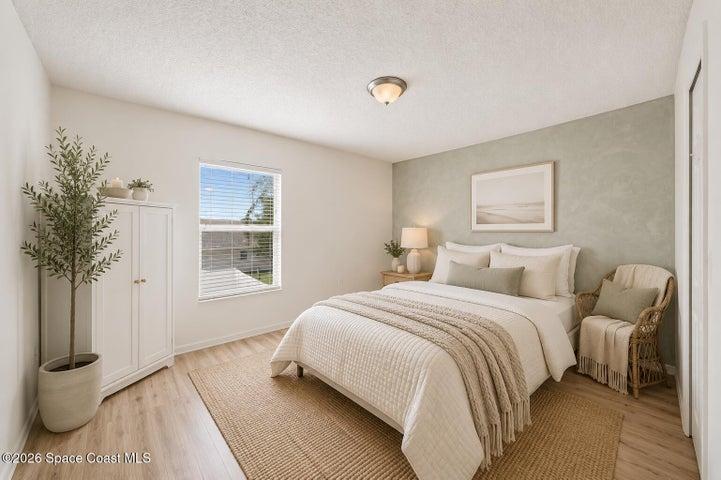 Bedroom 2 has been digitally enhanced/staged to show potential.