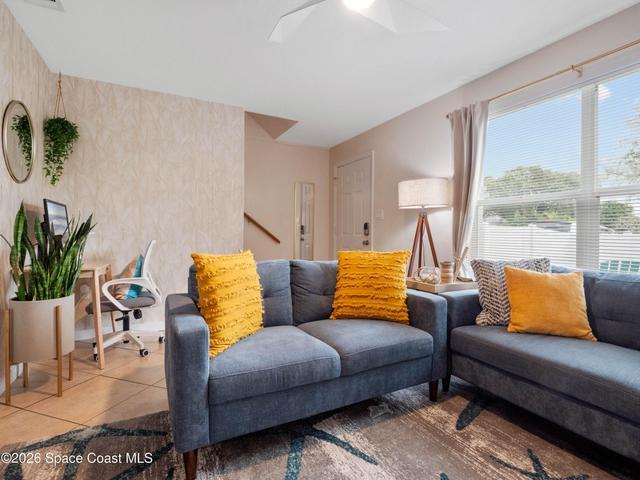 Bright and inviting living room with comfortable seating and abundant natural light.
