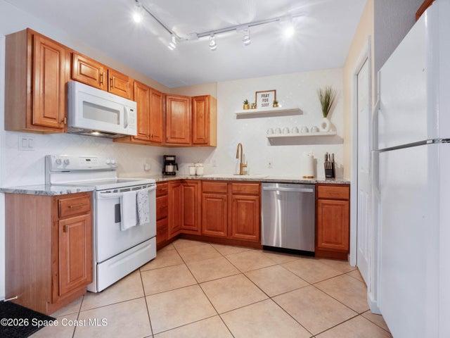 Well appointed kitchen featuring ample cabinetry and generous counter space