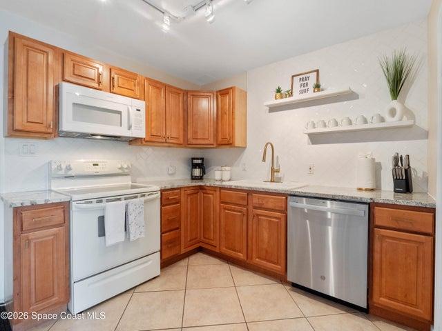 Another view of the spacious kitchen showcasing its efficient layout.