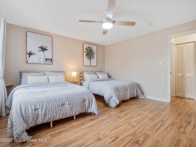 Spacious guest bedroom with room for multiple beds, ideal for family and guests.
