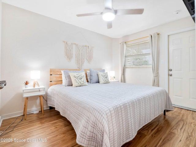 Spacious primary bedroom offering a relaxing coastal retreat.