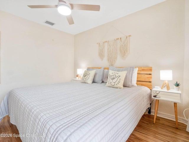 Primary bedroom filled with natural light and comfortable living space.