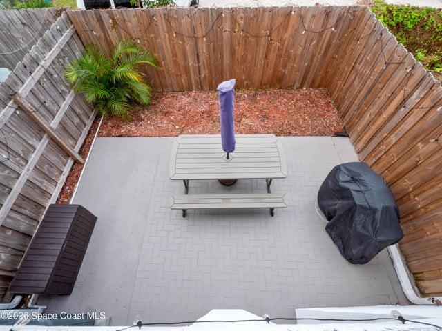 Private fenced patio offering the perfect space for outdoor dining, grilling, or relaxing.