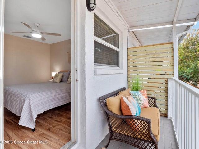 Private balcony directly accessible from the primary bedroom, perfect for enjoying the ocean breeze.
