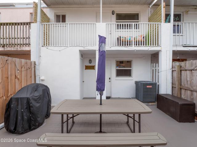 Private backyard patio creates an inviting outdoor living area.