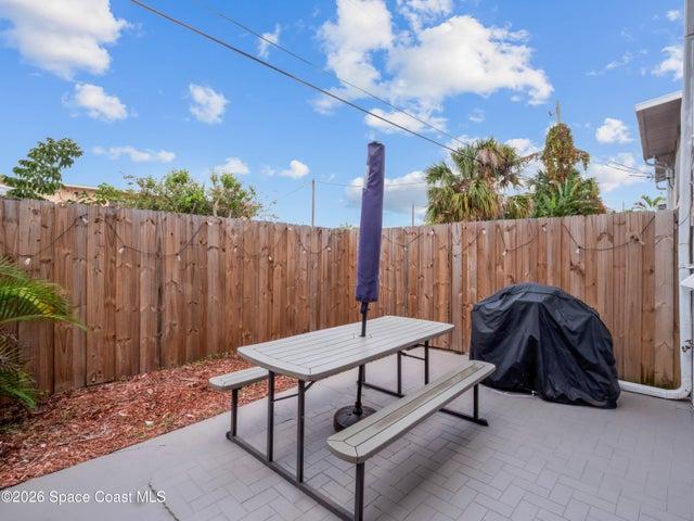 Another view of the fenced patio, ideal for entertaining or enjoying Florida's beautiful weather.