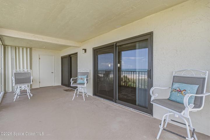 Unlike many oceanfront condominiums where HVAC equipment is located on the roof, this residence provides easy access to the A/C condenser behind the protected balcony shutters—making routine servicing significantly more convenient. Sliders feature Turtle Glass. The Patio has storm shutters and a storage closet.