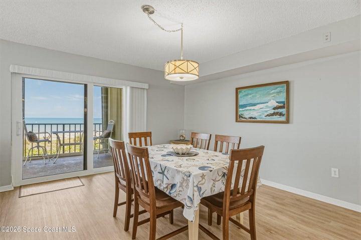 Dining Room opens to the covered ocean balcony for expansive alfresco dining.