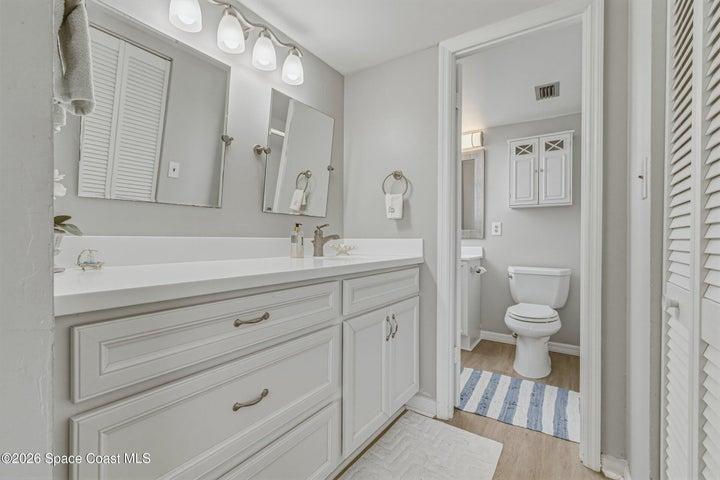 Fresh coastal-inspired bath continue the home's light and airy feel.