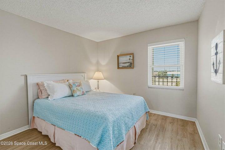 Guest bedroom with impact rated west facing window